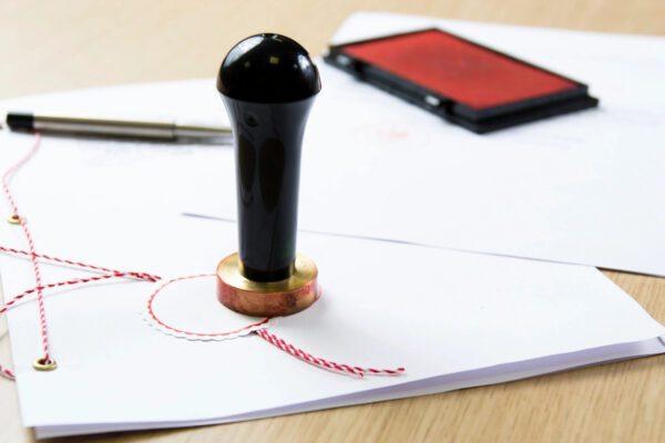 A rubber stamp sitting on top of some paper.